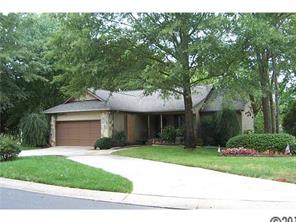 31005 Executive Point Tega Cay, SC 29708 - Photo 1 of 16 a view of a house with a yard plants and large tree