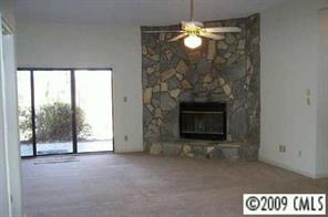 31005 Executive Point Tega Cay, SC 29708 - Photo 6 of 16 a view of a livingroom with a fireplace