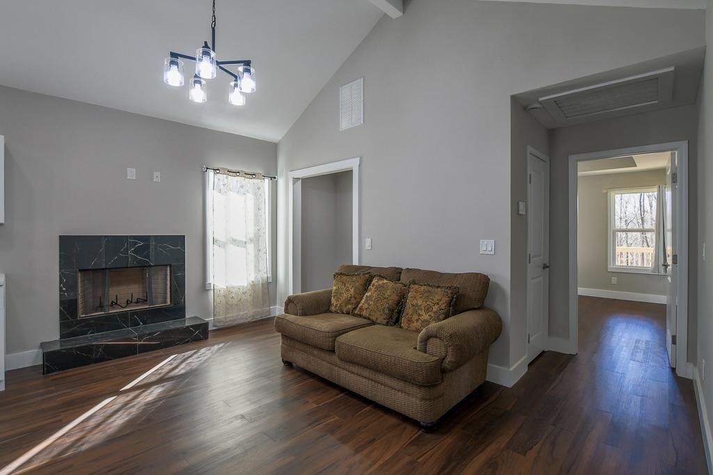 1020 Riverbend Road Commerce, GA 30530 - Photo 13 of 38 a living room with furniture and a fireplace