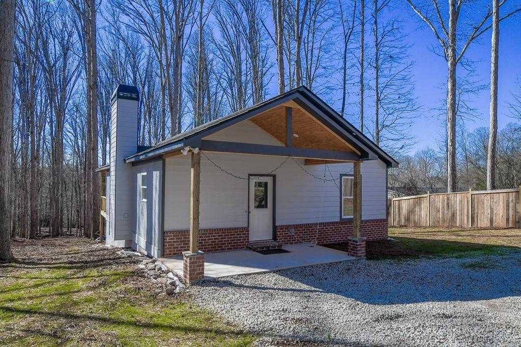 1020 Riverbend Road Commerce, GA 30530 - Photo 2 of 38 a front view of a house with garden