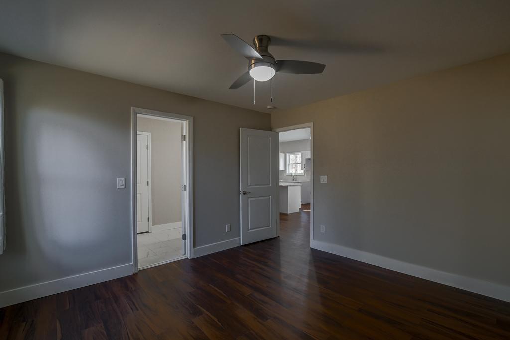 1020 Riverbend Road Commerce, GA 30530 - Photo 21 of 38 wooden floor in an empty room with a window
