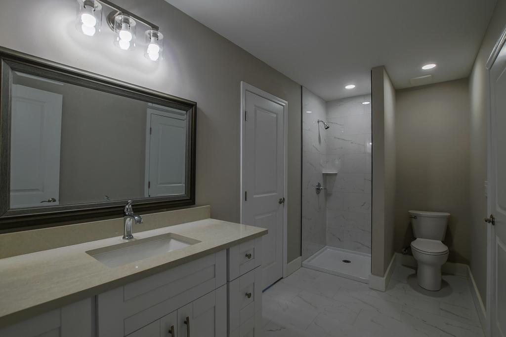 1020 Riverbend Road Commerce, GA 30530 - Photo 22 of 38 a bathroom with a sink and mirror