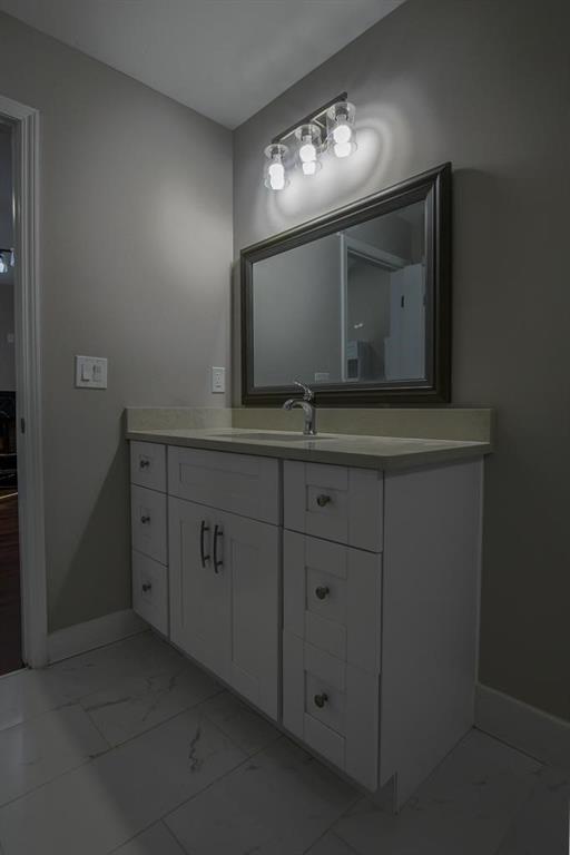 1020 Riverbend Road Commerce, GA 30530 - Photo 23 of 38 a bathroom with a sink and a mirror