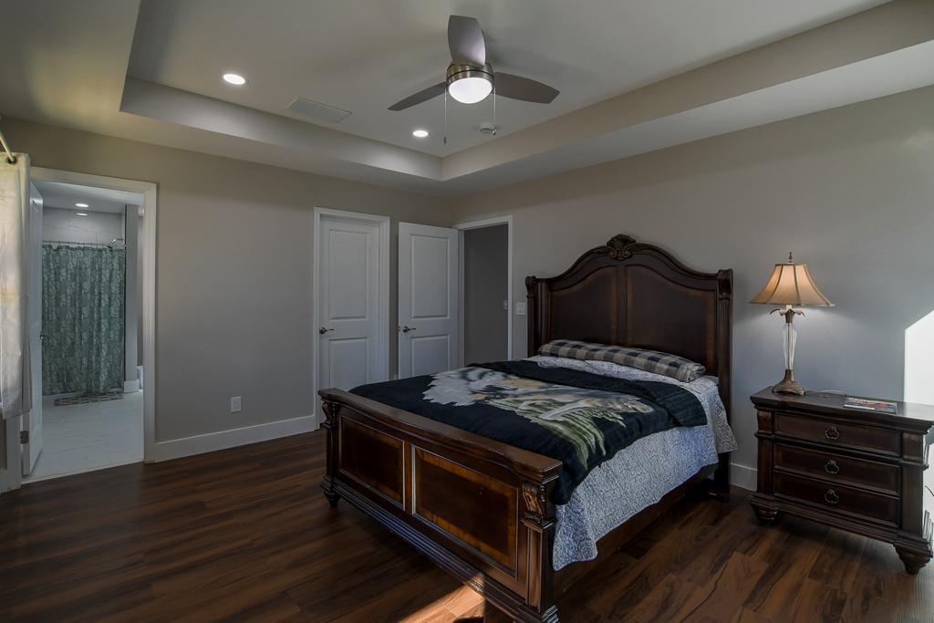 1020 Riverbend Road Commerce, GA 30530 - Photo 25 of 38 a bedroom with a bed and wooden floor