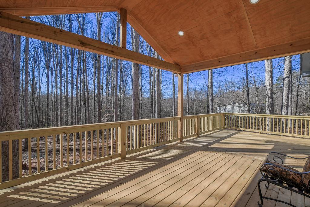 1020 Riverbend Road Commerce, GA 30530 - Photo 28 of 38 a view of deck with wooden floor and outdoor seating