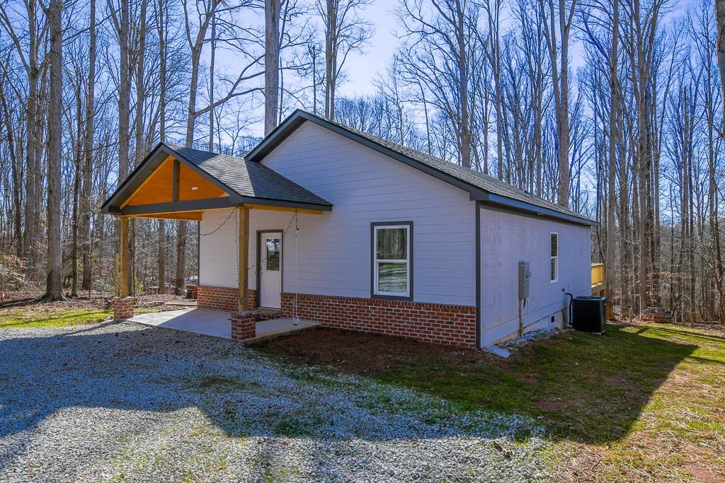1020 Riverbend Road Commerce, GA 30530 - Photo 3 of 38 a front view of a house with garden