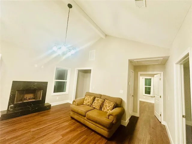 a view of room with wooden floor