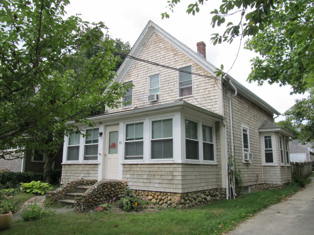 81 Edgartown Vineyard Haven Road Vineyard Haven, MA 02568 - Photo 1 of 16 a front view of a house with a yard