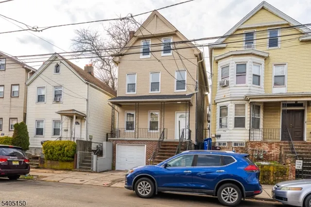 a car parked in front of a house