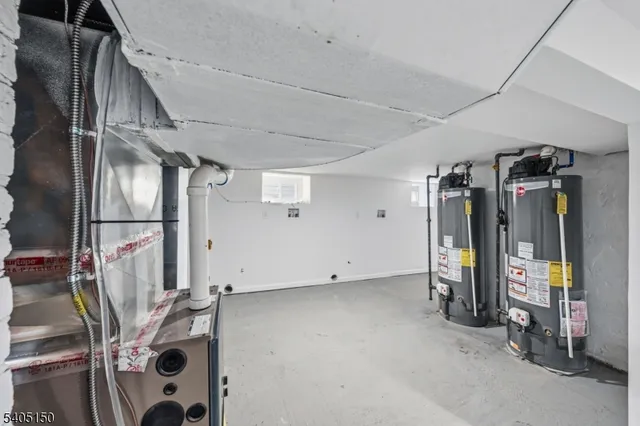 a view of a yard in front of a house with large tree