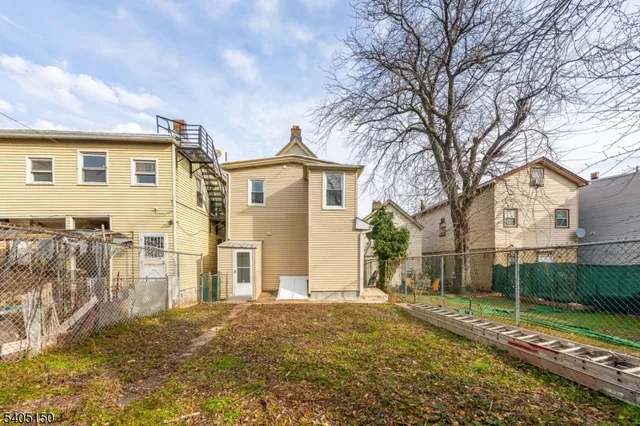 a car parked in front of a white house