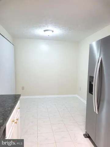 an empty room with a bathroom