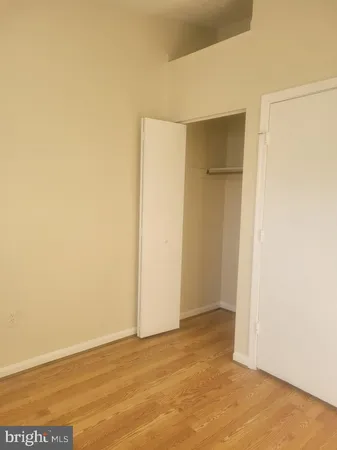 a view of an empty room with a fireplace