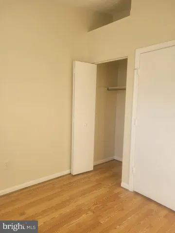 a view of an empty room with a fireplace