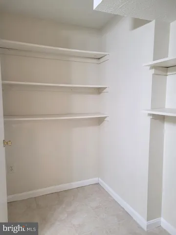 a bathroom with a toilet a sink and shower
