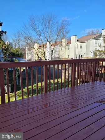 a view of wooden deck and a yard