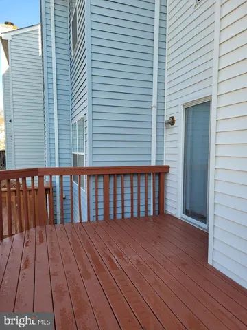 a backyard of a house with barbeque oven and outdoor seating