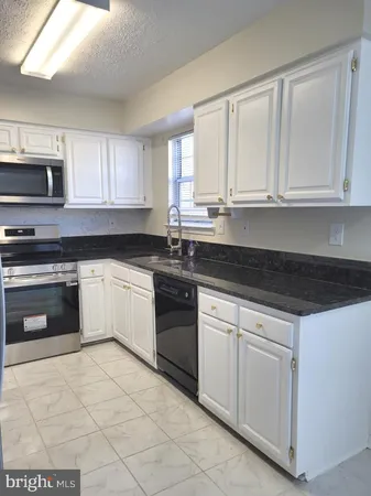 a view of kitchen island with wooden floor