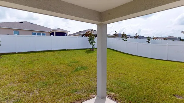 a view of a large pool with an ocean view