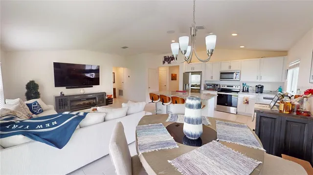 a living room with lots of furniture and a flat screen tv