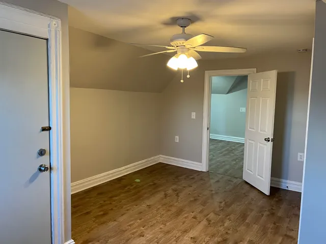 wooden floor in an empty room and a window