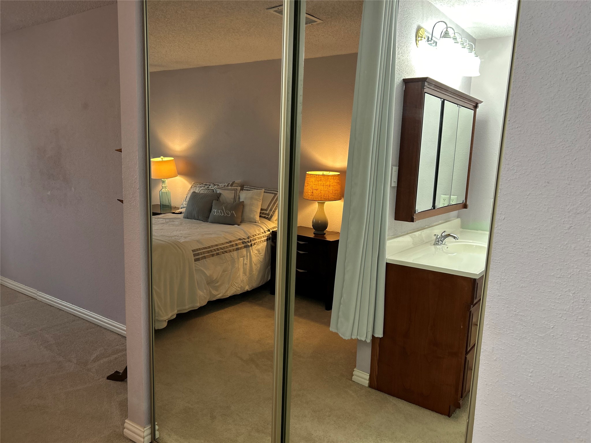 13034 Leader Street, Unit 965 Houston, TX 77072 - Photo 25 of 32 Upstairs bed & bath reflected in closet doors.