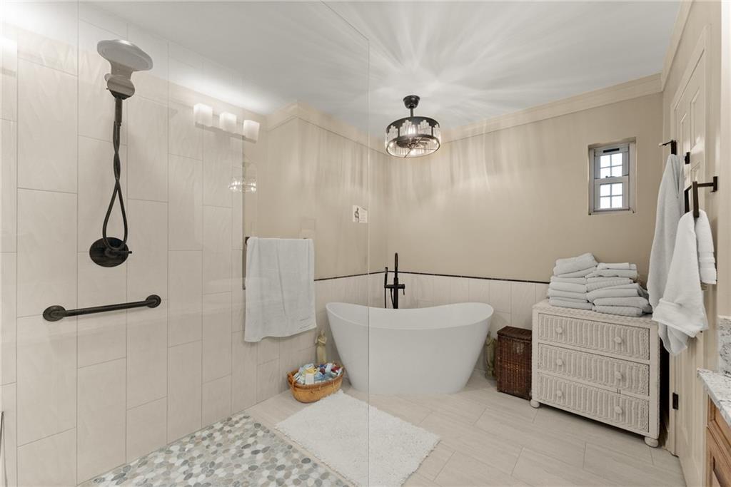 7215 Kelly Bridge Road Dawsonville, GA 30534 - Photo 18 of 87 a living room with furniture and a chandelier