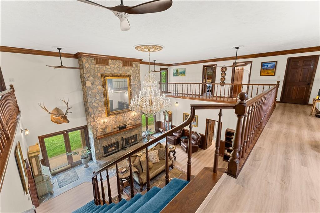 7215 Kelly Bridge Road Dawsonville, GA 30534 - Photo 19 of 87 a view of an entryway with wooden floor and windows