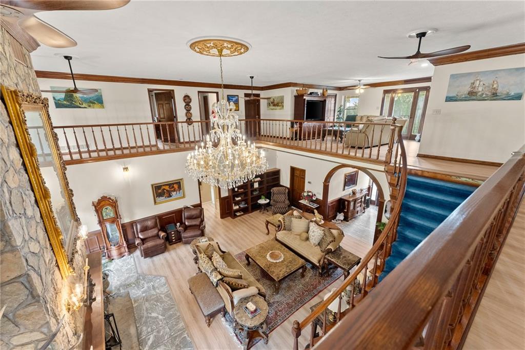 7215 Kelly Bridge Road Dawsonville, GA 30534 - Photo 25 of 87 a view of a livingroom with furniture wooden floor and windows