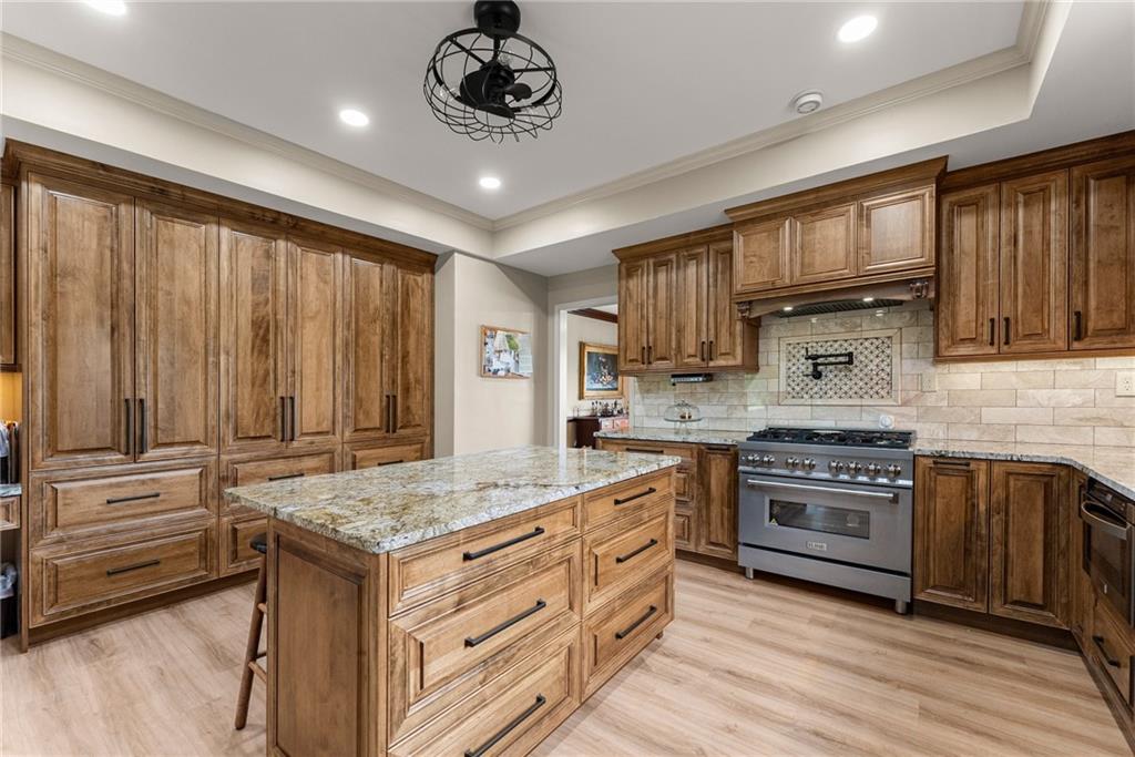 7215 Kelly Bridge Road Dawsonville, GA 30534 - Photo 41 of 87 a kitchen with a stove and a sink