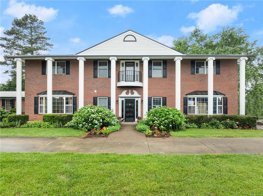 7215 Kelly Bridge Road Dawsonville, GA 30534 - Photo 5 of 87 a front view of a house with a yard