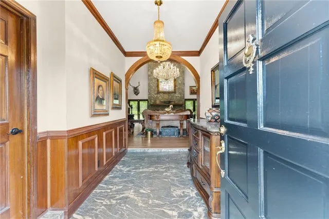 a living room with furniture a rug and a large window