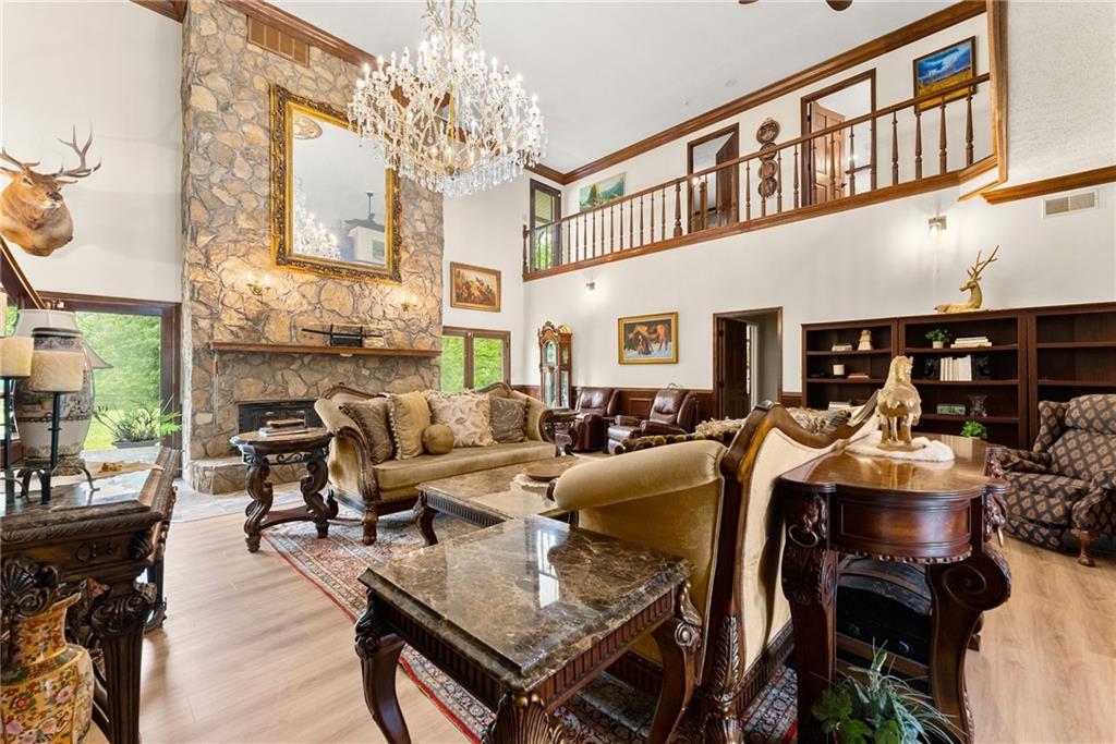 7215 Kelly Bridge Road Dawsonville, GA 30534 - Photo 8 of 87 a living room with fireplace furniture and a large window