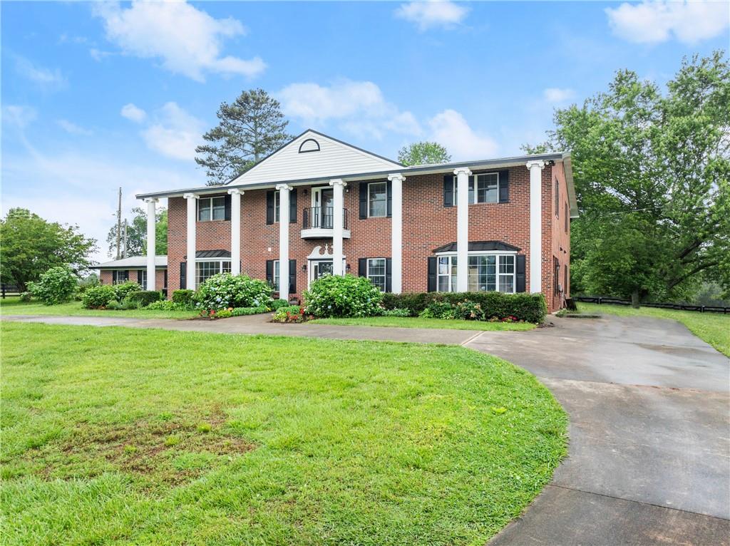 7215 Kelly Bridge Road Dawsonville, GA 30534 - Photo 85 of 87 front view of a house with a yard