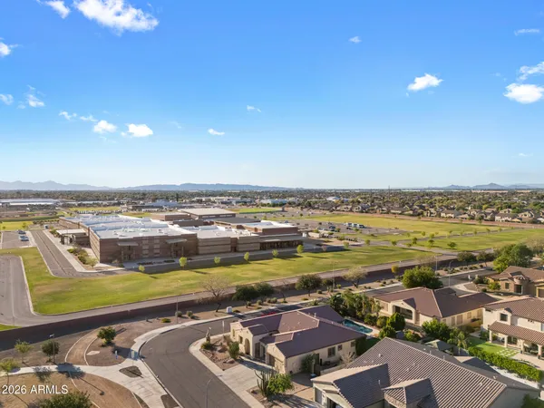 a view of a bench in the patio next to a yard