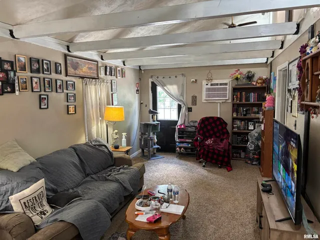 a bedroom with bed and a potted plant