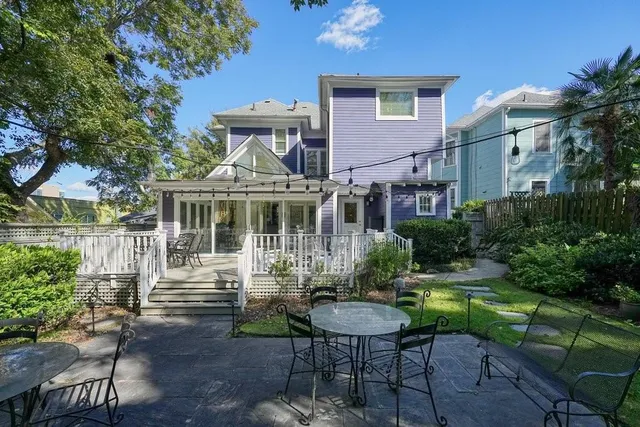 a front view of a house with a yard table and chairs