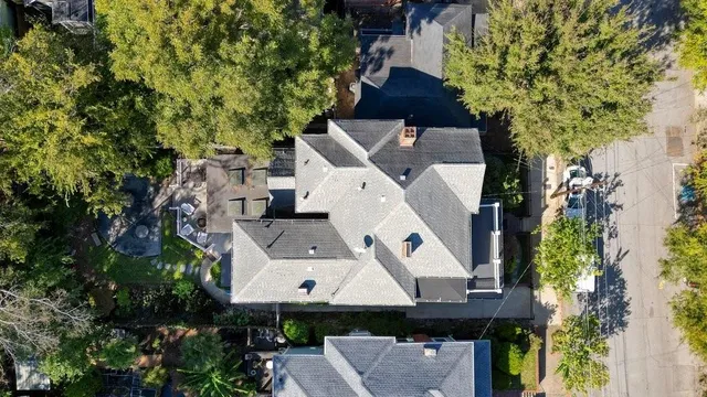 an aerial view of a house with swimming pool