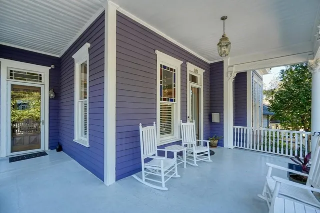a view of a patio with a table and chairs