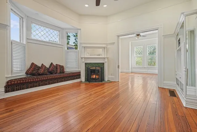 a living room with furniture and a fireplace