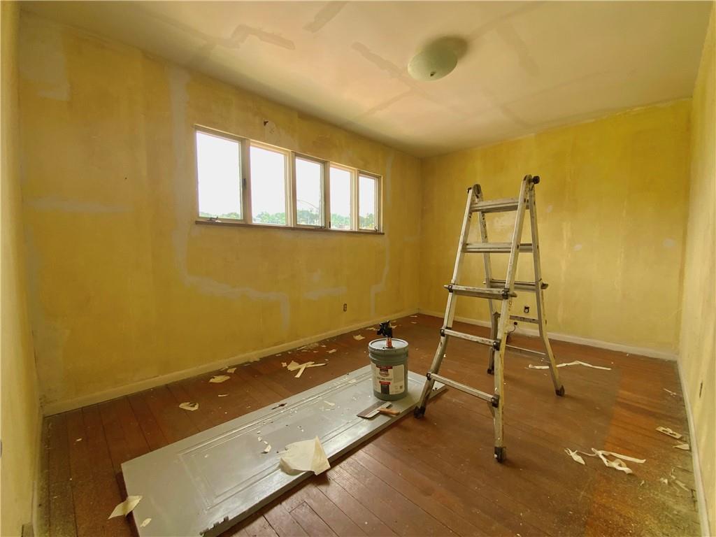1109 Progress Street McKees Rocks, PA 15136 - Photo 16 of 30 a room with gym equipment and windows