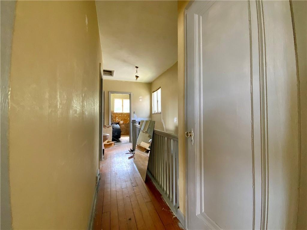 1109 Progress Street McKees Rocks, PA 15136 - Photo 17 of 30 a view of a hallway with wooden floor