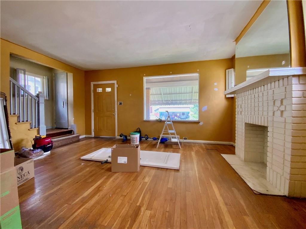 1109 Progress Street McKees Rocks, PA 15136 - Photo 2 of 30 a living room with furniture and a fireplace