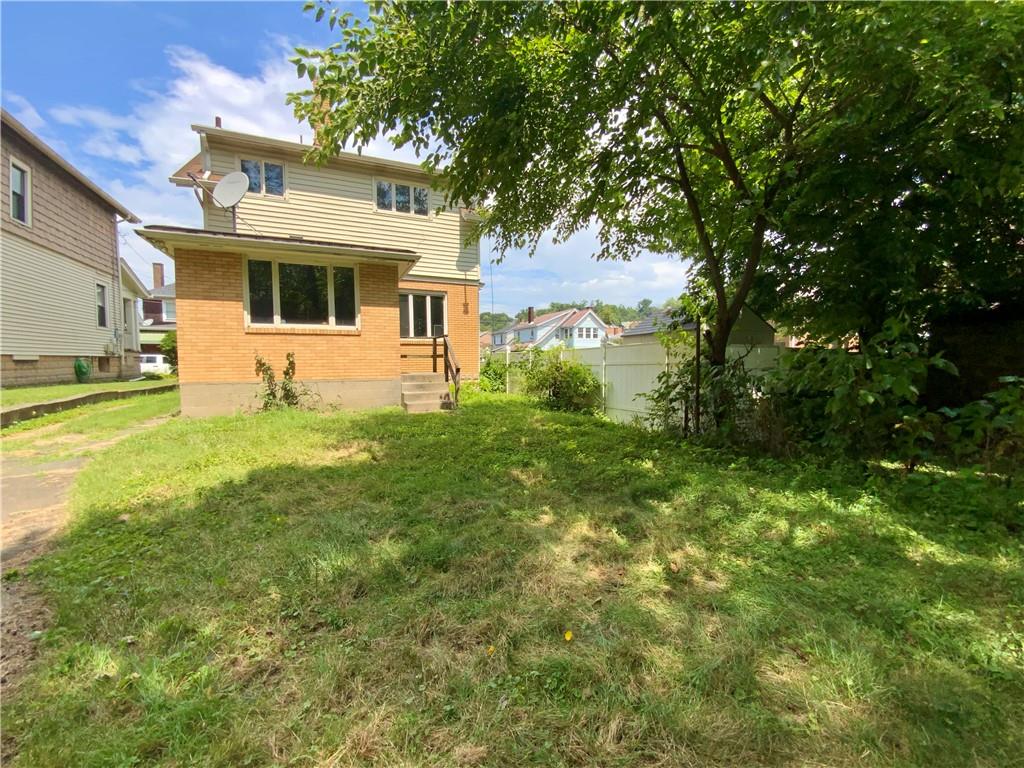 1109 Progress Street McKees Rocks, PA 15136 - Photo 28 of 30 a big white house with a big yard and large trees