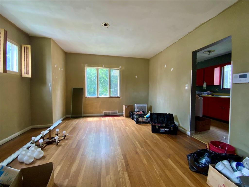 1109 Progress Street McKees Rocks, PA 15136 - Photo 3 of 30 a bedroom with furniture and a wooden floor