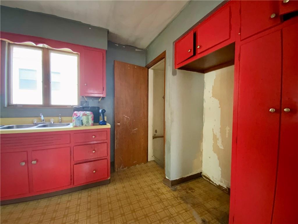 1109 Progress Street McKees Rocks, PA 15136 - Photo 7 of 30 a kitchen with a sink cabinets and a window