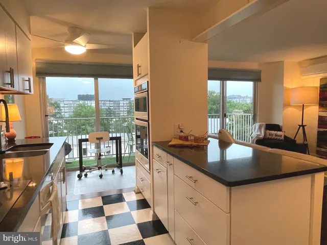 a kitchen with granite countertop a sink and a cabinets