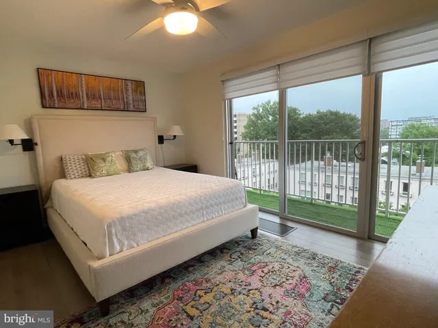 a bedroom with a bed and a mirror