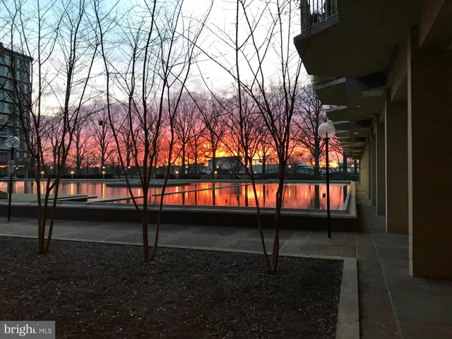 a view of a terrace with lawn chairs