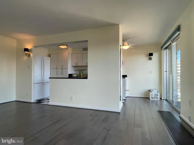 a kitchen with kitchen island a sink stainless steel appliances and cabinets